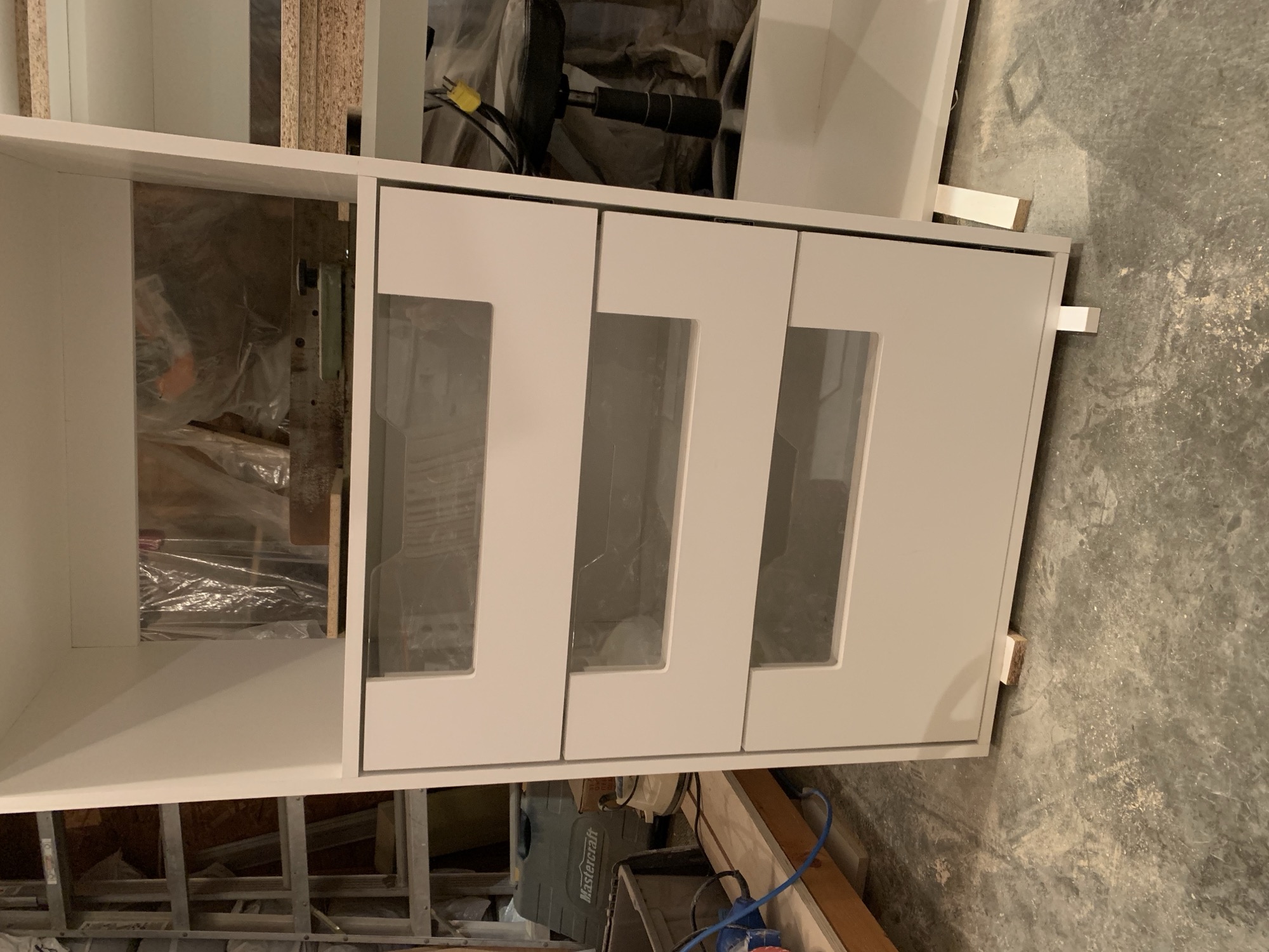 Modern closet with acrylic doors.