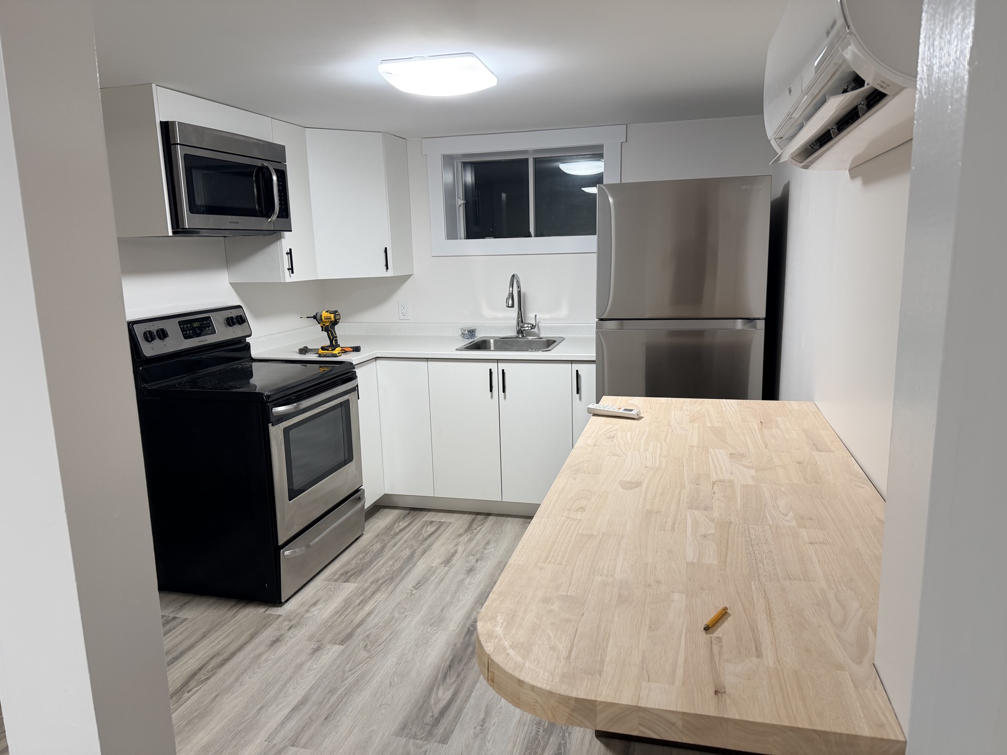 Custom tiny kitchen with cusctom cabinetry