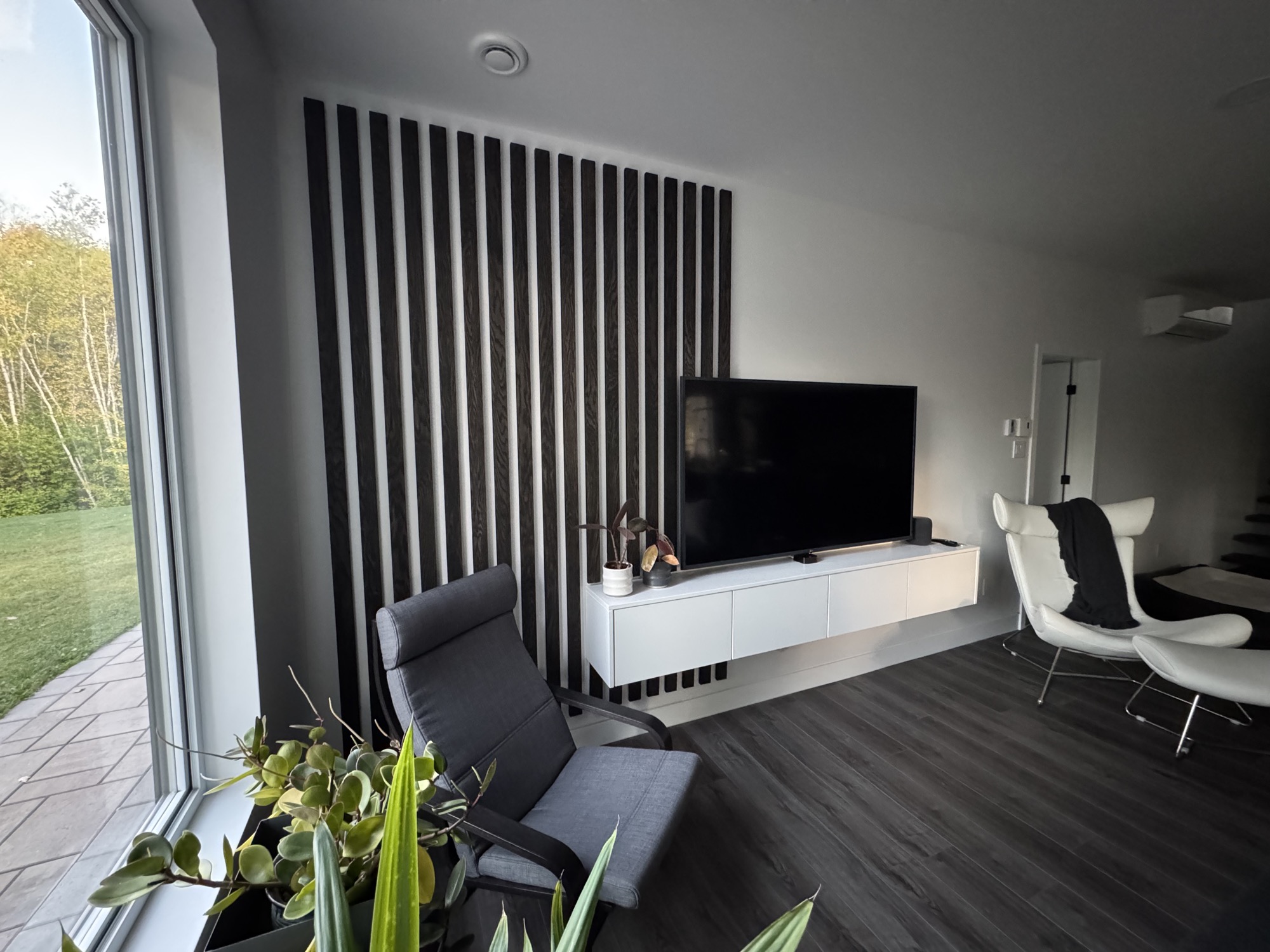 Modern living room accent wall with built-in shelving.